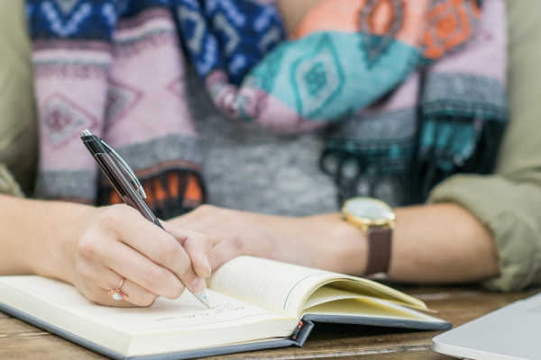 Woman writing in a journal